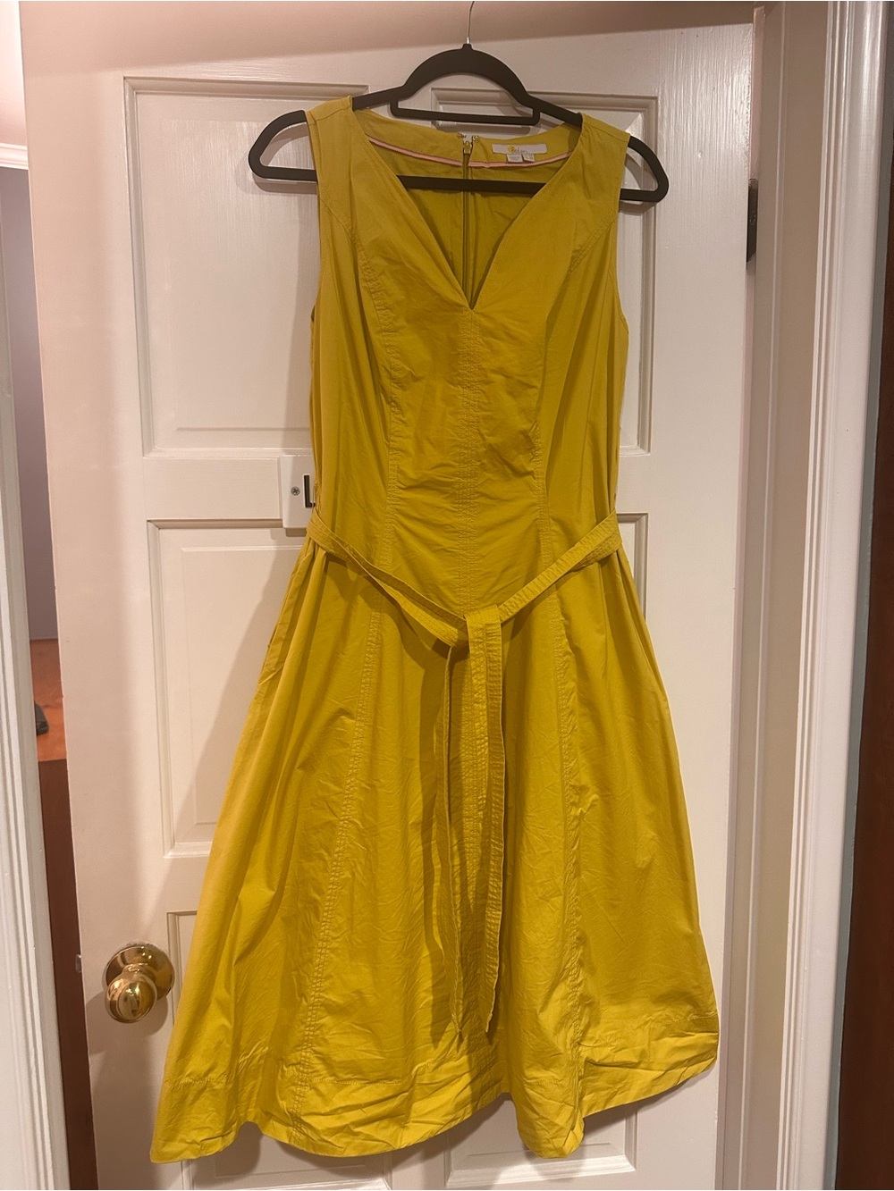 Yellow Sleeveless Belted A-Line midi dress with pockets. A V neck & zip up back.